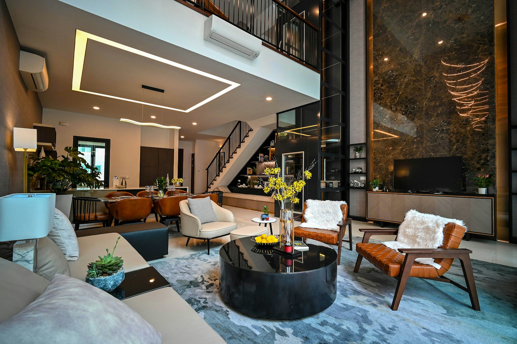 A warm modern living room with wood beams and leather furniture.